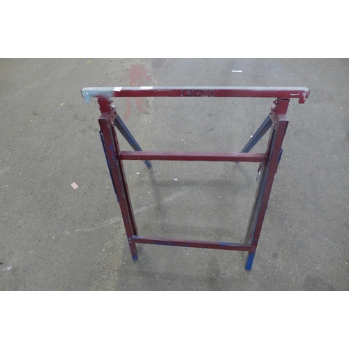 2238 - A metal folding trestle table and a plaster board support tool