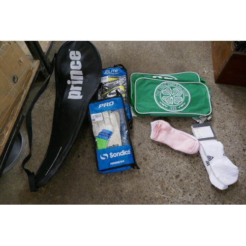 2321 - A box of assorted sporting items; gloves, bags, etc.