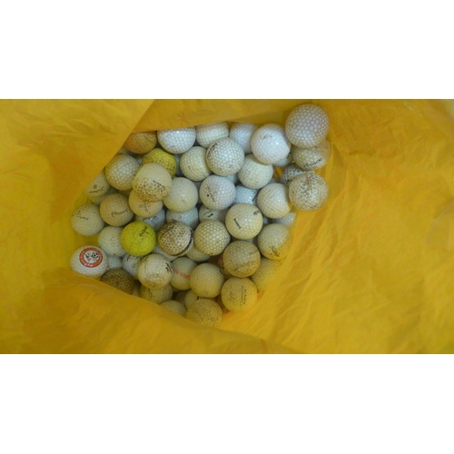 2342 - A box of assorted golf balls and 8 assorted clubs