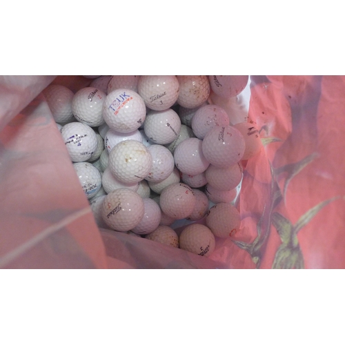 2342 - A box of assorted golf balls and 8 assorted clubs