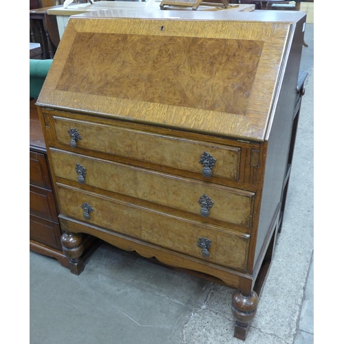 101 - An early 20th Century oak and burr walnut bureau