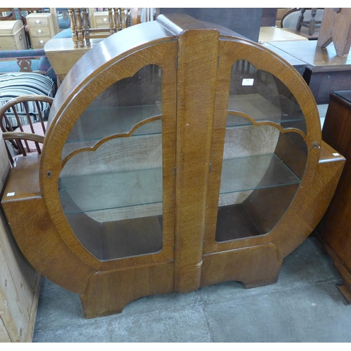 106 - An Art Deco oak display cabinet