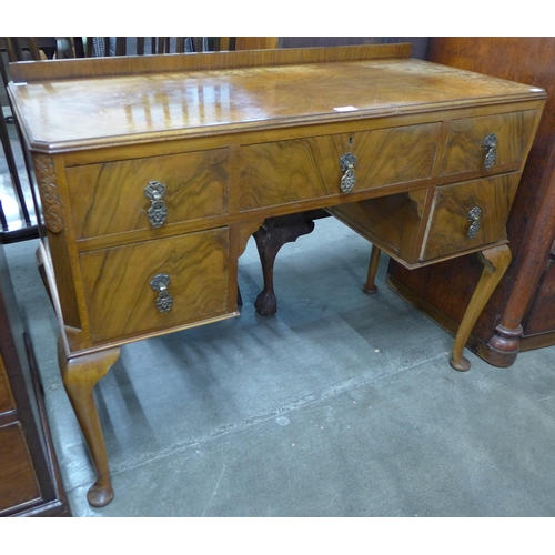 109 - A Queen Anne style figured walnut desk