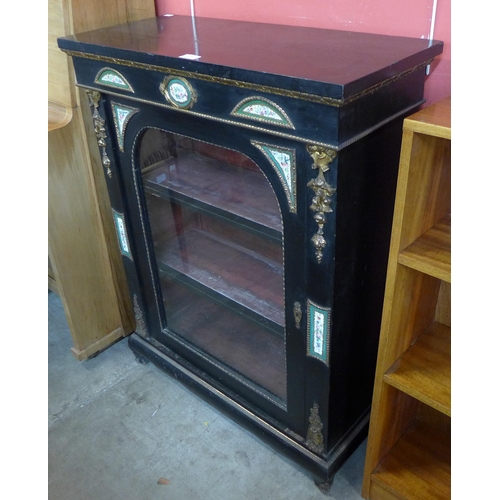 123 - A 19th Century French ebonised and ormolu pier cabinet, with Sevres style porcelain mounts