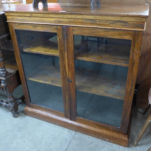 134 - A Regency rosewood, mahogany and stained pine two door bookcase