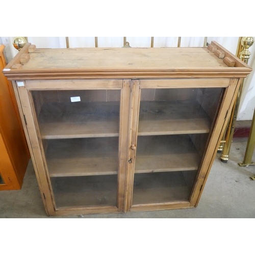 243 - A Vitorian pine two door bookcase