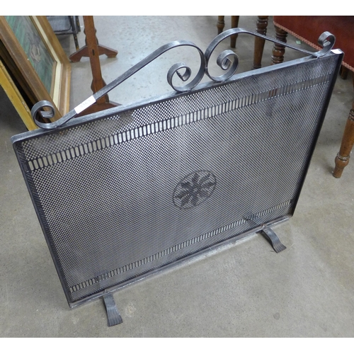 257 - A fabric dressing screen and a wrought iron spark guard