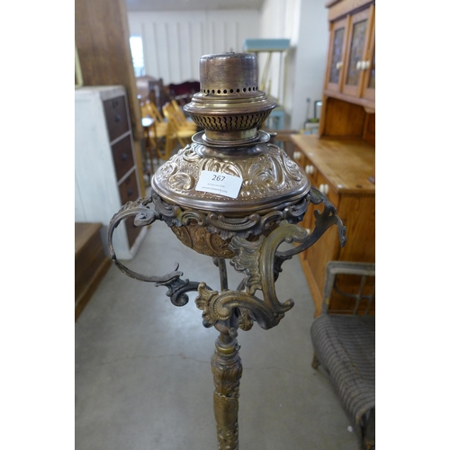 267 - A French Art Nouveau brass and copper floor standing oil lamp