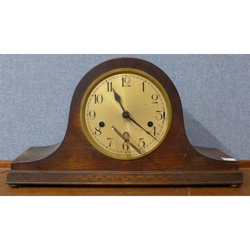 341 - An early 20th Century oak mantel clock