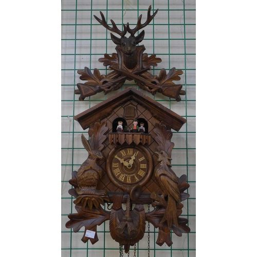 356 - A Black Forest carved wood cuckoo clock