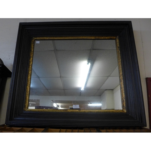 363 - A large Victorian style ebonised and parcel gilt framed mirror