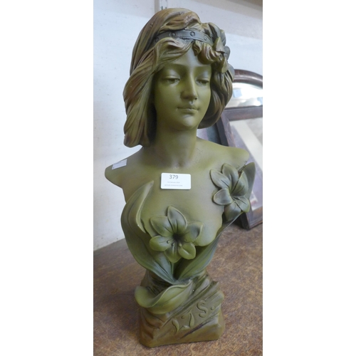 379 - An Art Nouveau style faux pottery bust of a lady