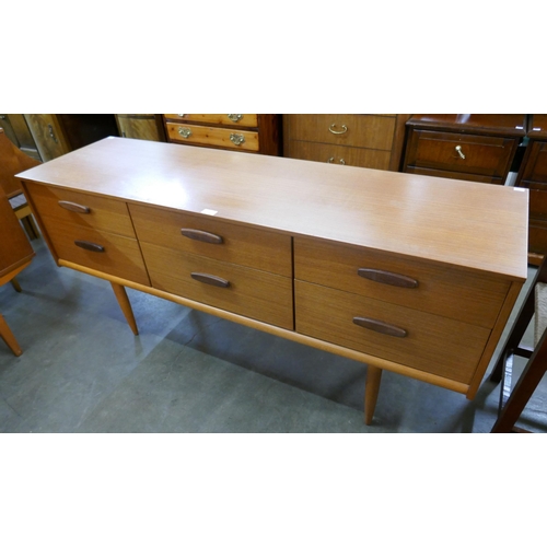 44 - An Austin Suite teak six drawer sideboard