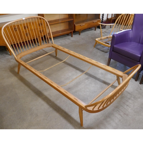 75 - An Ercol Blonde beech single bed frame