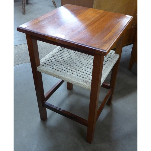 89 - A teak and rattan occasional table