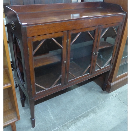 93 - An Edward VII mahogany three door bookcase