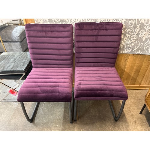 1308 - A pair of aubergine velvet side chairs * This lot is subject to VAT