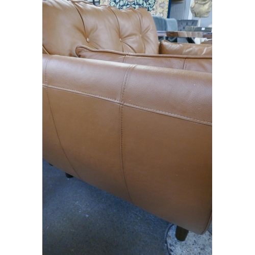 1336 - A tan leather Hoxton love seat, RRP £1539