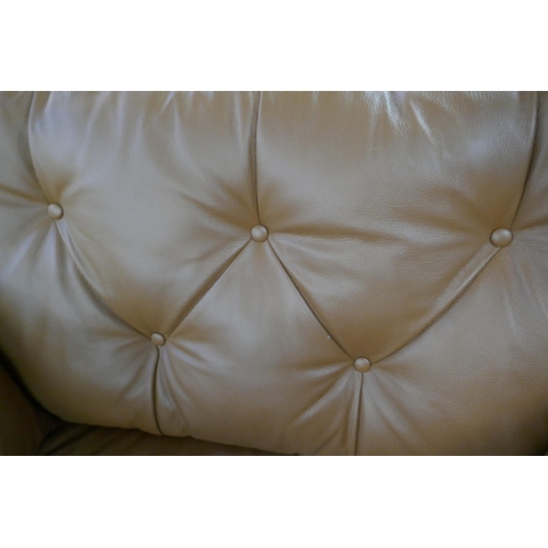 1337 - A tan leather Hoxton love seat, RRP £1539