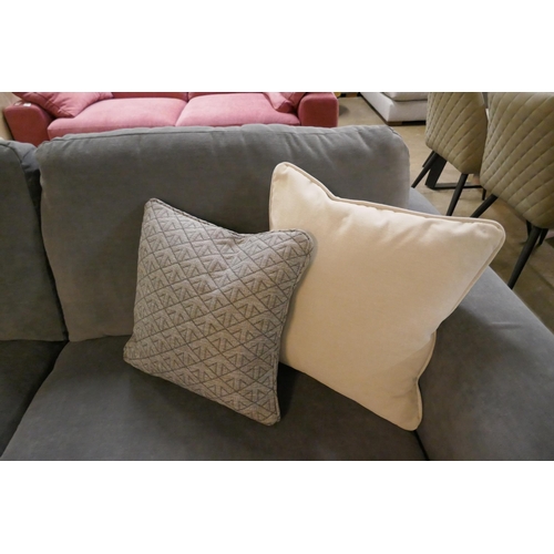 1351 - A steel blue three seater sofa and contrasting off white three seater sofa