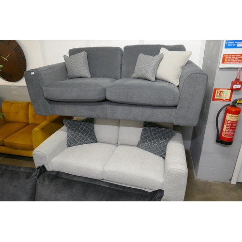 1351 - A steel blue three seater sofa and contrasting off white three seater sofa