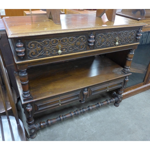 118 - A late Victorian Elizabethan Revival carved walnut two drawer buffet