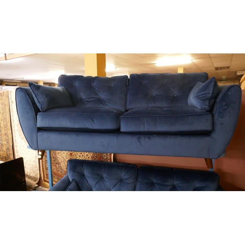 1577 - A pair Hoxton blue velvet upholstered three seater sofas with two footstools, RRP £2198