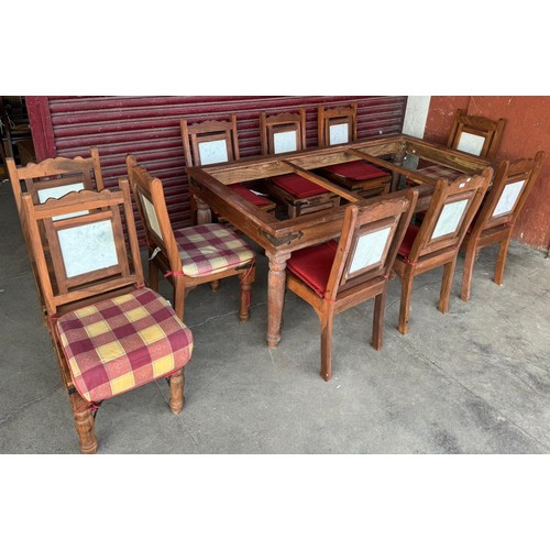 197 - An eastern hardwood and marble topped dining table and chairs