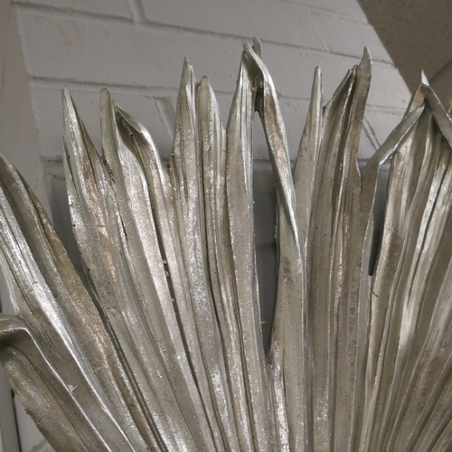 1393 - A silver wall mounted ornamental Trachycarpus Fortunei palm leaf