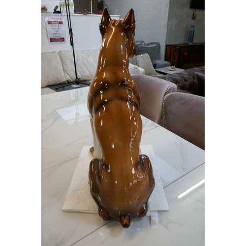 1459 - A glazed tall ornamental Boxer dog