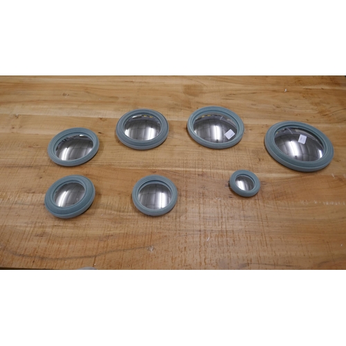 1510 - A set of seven flocked convex mirrors