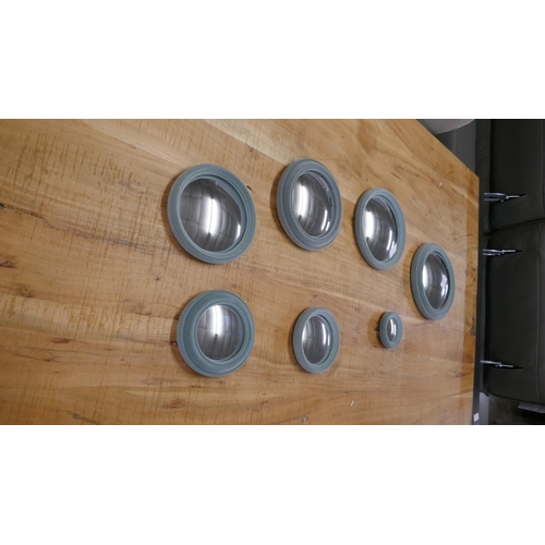 1510 - A set of seven flocked convex mirrors