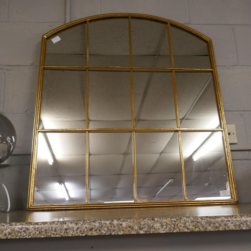 1513 - A gold framed arched mirror