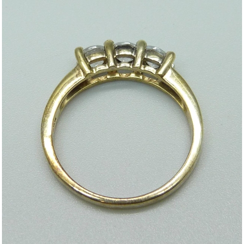 1004 - A silver gilt trilogy ring, R