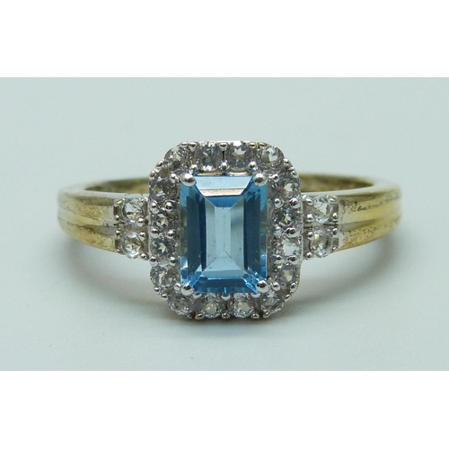 1020 - A silver gilt, Swiss blue topaz and white stone ring, U