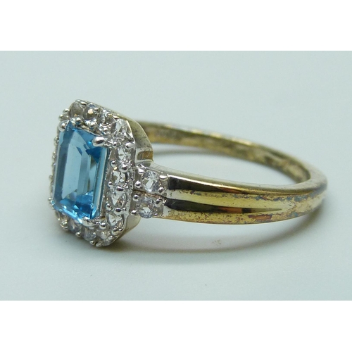 1020 - A silver gilt, Swiss blue topaz and white stone ring, U