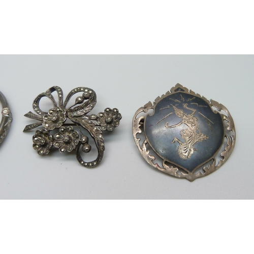 1036 - A silver bangle, a marcasite set silver brooch and a Siam silver brooch, 23.9g