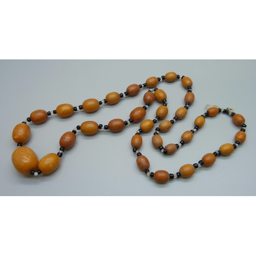 1039 - A set of butterscotch amber beads, 40.5g, 73cm