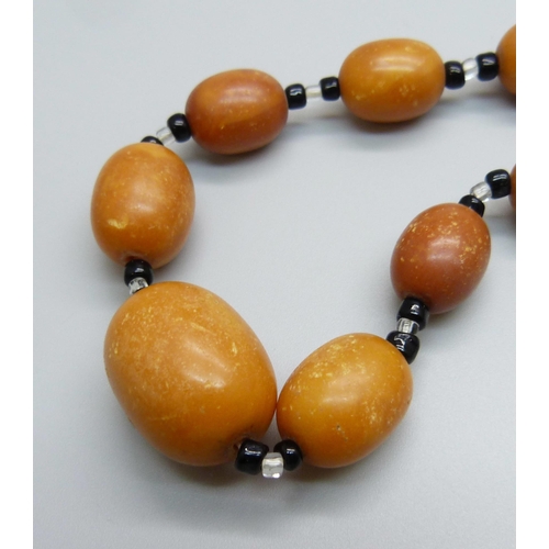 1039 - A set of butterscotch amber beads, 40.5g, 73cm