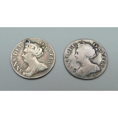 1047 - Two Queen Anne sixpence coins, one drilled