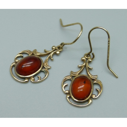 1064 - A pair of 9ct gold amber earrings, 3.6g