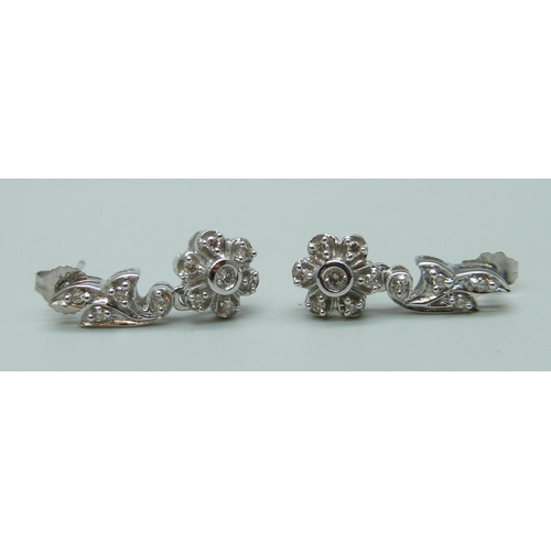 1065 - A pair of 9ct white gold and diamond earrings, 3.1g