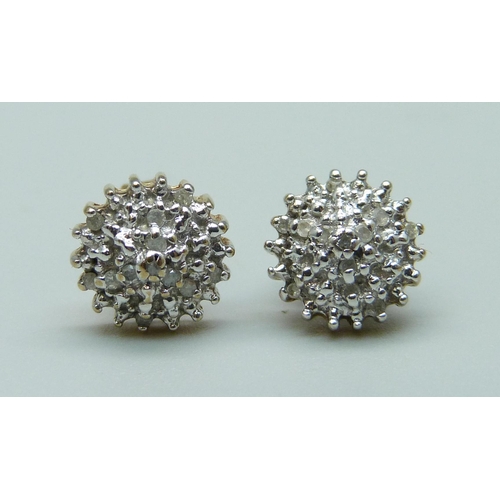 1069 - A pair of 9ct gold and diamond cluster earrings, 1.9g