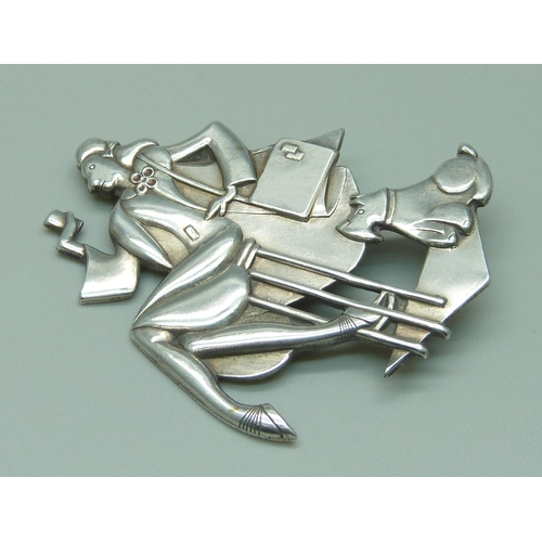 1087 - A large Art Deco style brooch, lady and dog