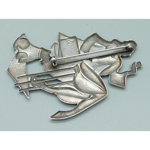 1087 - A large Art Deco style brooch, lady and dog