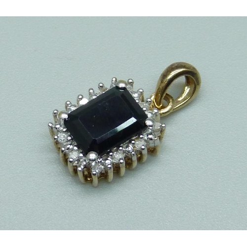 1093 - A 9ct gold pendant set with a sapphire and diamonds, 1.9g