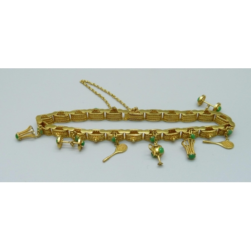 1107 - A yellow metal and jade set bracelet with badminton related charms, marked 14k, 16.5g