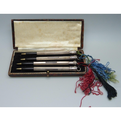 1113 - A sterling silver bridge pencil set, cased