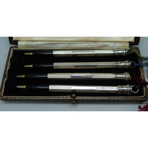 1113 - A sterling silver bridge pencil set, cased