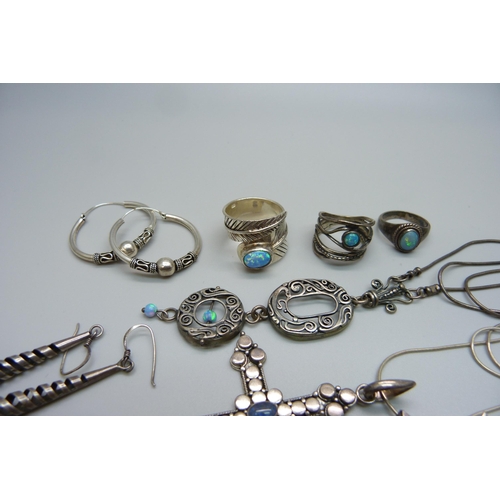 1118 - A collection of silver jewellery including a large silver cross pendant set with opal